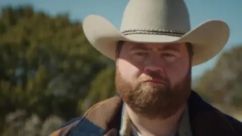Still 6 of Americana (2023) BluRay [Hindi (DD5.1) & English] 4K 1080p 720p & 480p Dual Audio [x264/10Bit-HEVC]
